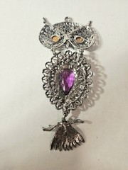 a Rare 1970s Articulated Owl Pendant featuring purple faux-amethyst glass…