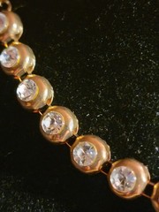 Vintage tennis-style chain necklace with round stones in a bezel setting.