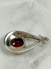 Sterling Silver Teardrop Pendant with Reddish Brown Faceted Oval Stone – 1″