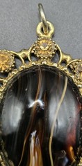 Vintage Ornate Gold Tone Oval Pendant Brown Black Stone Decorative Accents