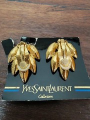 Yves Saint Laurent gold plated earrings, set with light blue and blue crystals