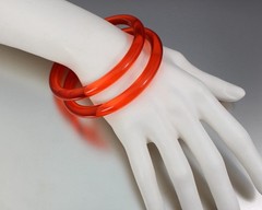 LOT OF 2 VINTAGE ORANGE PLASTIC LUCITE BANGLE BRACELETS