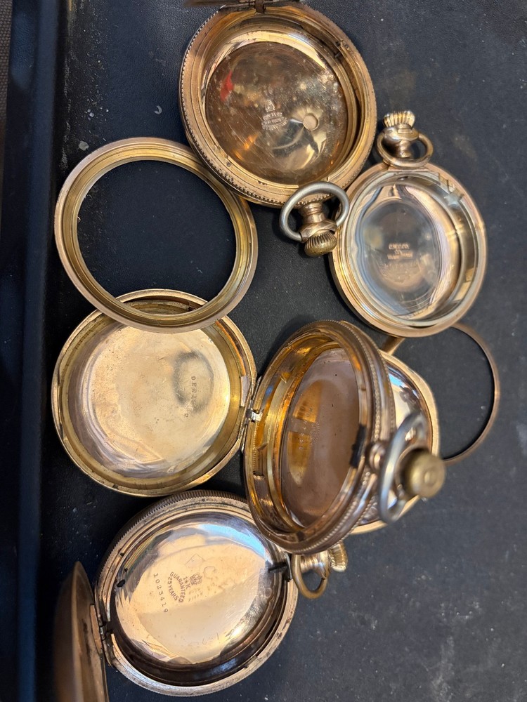 243 grams gold filled pocket watch cases. all marked “25 years”