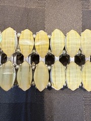 Vintage with an expandable Lucite bracelet in great condition. 1.5″ wide