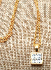 Vtg Givenchy Gold Tone Sm Pendant Channel Set Cubic Zirconia Reverse Side Logo
