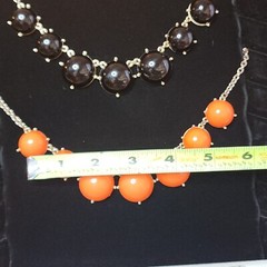 2 Statement Necklaces each 18″-20″ one Black and one Orange.