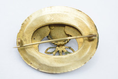 Antique Egyptian Revival winged scarab brooch featuring vibrant enamel work