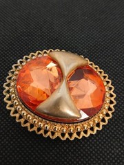 DENISE 195Os goldtone applied bow large faceted orange glass stone brooch