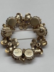 KARU ARKEING floral and amber pin