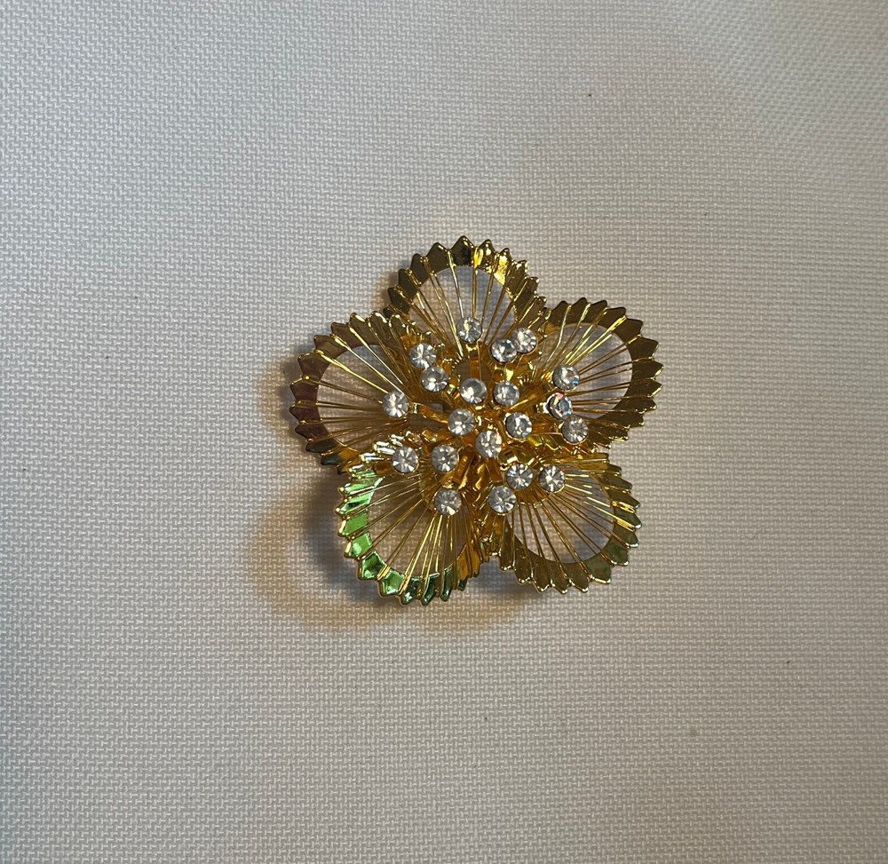 Gold tone Flashy Floral Pin With Multiple Simulated Diamonds