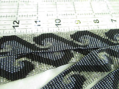 vintage 56-inch necklace or belt, beaded in blue, white, black wave pattern