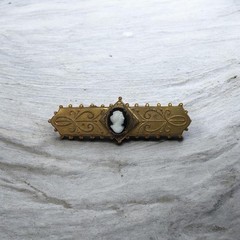 Victorian Gold filled bar pin with cameo on top of black onyx centerpiece