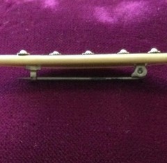 vintage celluloid bar pin with pearl look insets. Est. from the 1930-1940’s