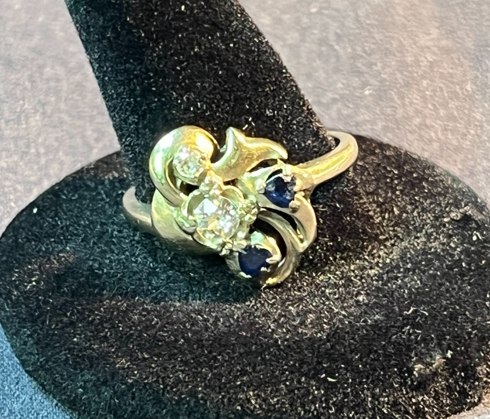 Ringcraft ring is crafted from 14k yellow gold/diamond and sapphire accents