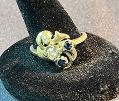 Ringcraft ring is crafted from 14k yellow gold/diamond and sapphire accents