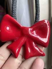 Vintage flying colors signed ceramic red bow Black Cord necklace