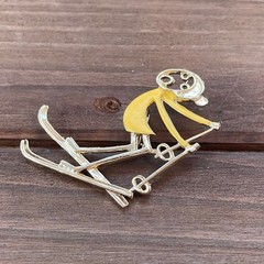 Vintage Ski Pin Falling Skier Gold Tone Yellow Enamel Cartoon Style R.N. Koch