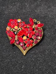 Gold tone Red heart brooch.