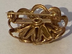 Old, vintage gold tone rhinestone brooch