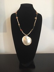 Shell Pendant on a Green, Gold, and Tan Necklace – 25.25 in.