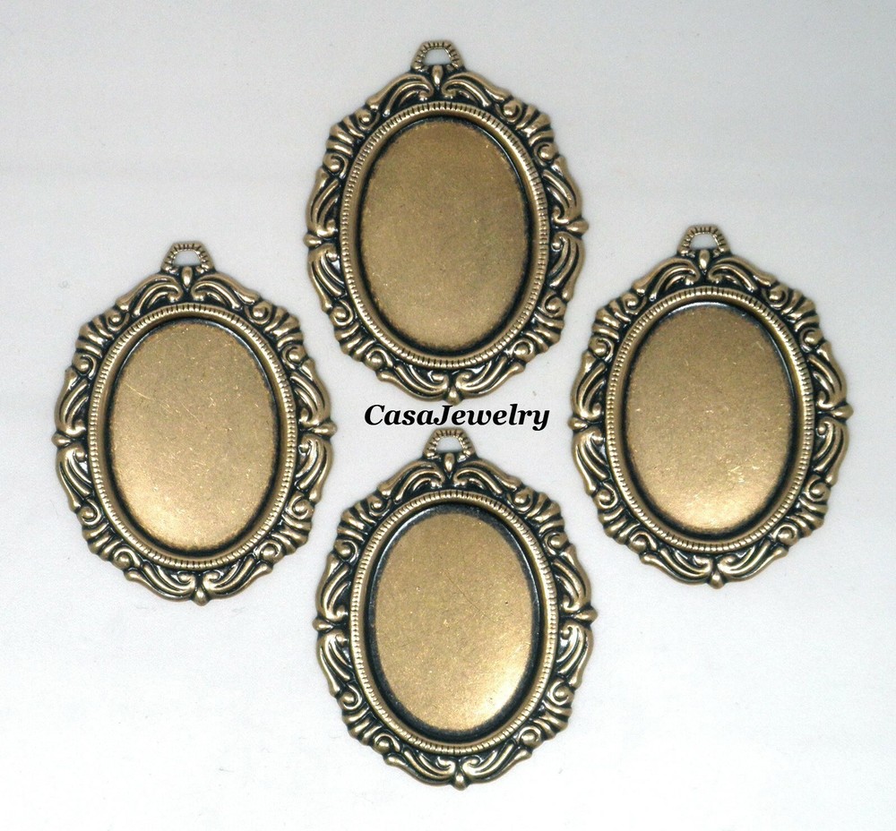 #1154 ANTIQUED GOLD 25X18 FILIGREE BORDER BEZEL W/TOP HANG RING – 4 Pc Lot