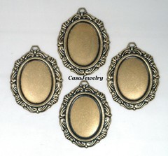 #1154 ANTIQUED GOLD 25X18 FILIGREE BORDER BEZEL W/TOP HANG RING – 4 Pc Lot