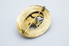 Antique Egyptian Revival winged scarab brooch featuring vibrant enamel work