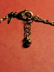 Vintage Avon Bracelet open pinched oval links light gold tone clear rhinestones.