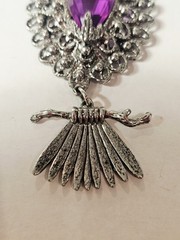 a Rare 1970s Articulated Owl Pendant featuring purple faux-amethyst glass…
