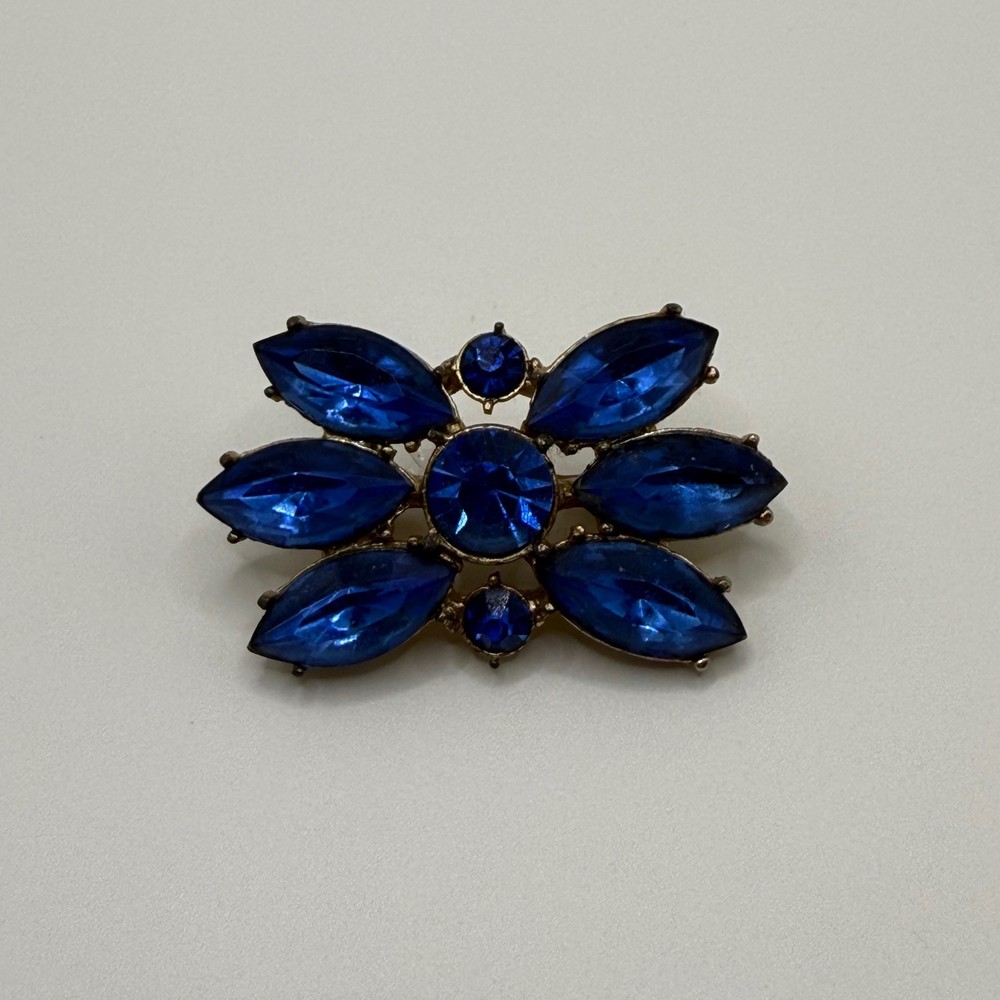 Vintage Sapphire Blue Rhinestone Floral Brooch Gold Tone Mid Century Sunburst