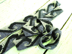 vintage 56-inch necklace or belt, beaded in blue, white, black wave pattern