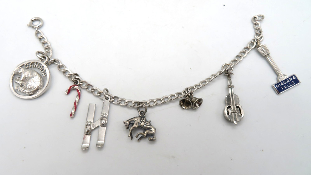 Vintage Sterling Silver Charm Bracelet with 7 Charms Ski Horse Niagara