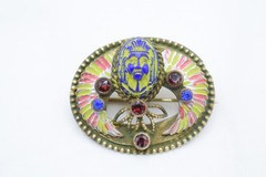 Antique Egyptian Revival winged scarab brooch featuring vibrant enamel work