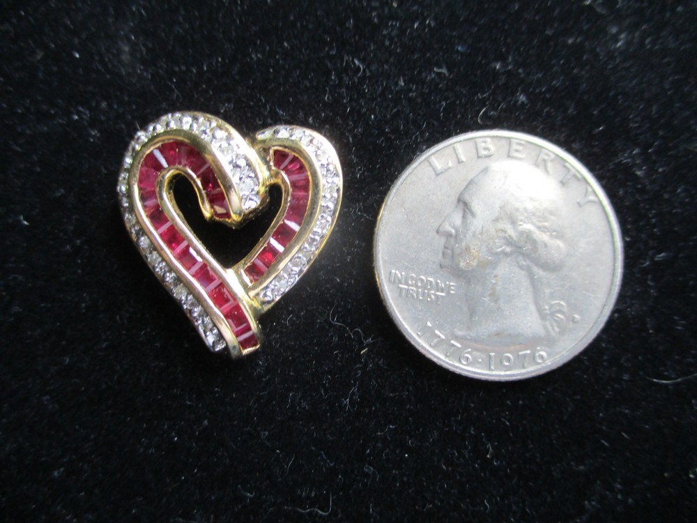 14K Solid Gold, (16) Diamonds & (22) Ruby’s. Heart Pendant.