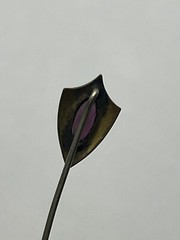 Antique Victorian gold tone stick pin purple glass faceted stone scroll design