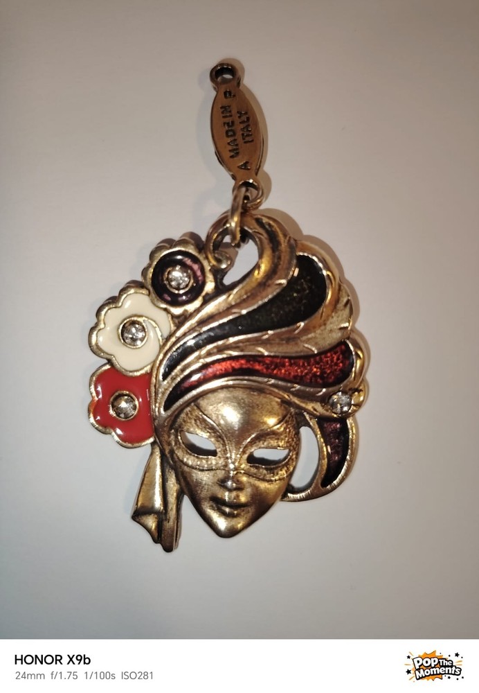 A Detailed Venetian Mask Charm in Gold-Tone Metal with Enamel and Crystal Detail