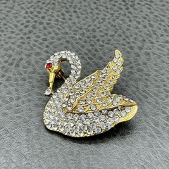 Vintage Swan Brooch Gold Tone Clear Rhinestone Bird Pin Red Eye Costume Jewelry