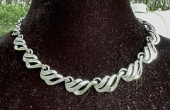 vintage Coro San Marco necklace features silver-toned linked swirl