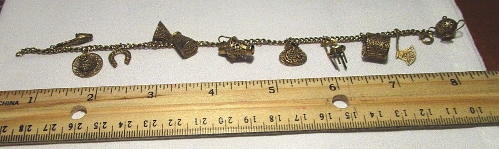Adorable Gilded Silver Vintage Charm Bracelet. Approximately 8″ long.