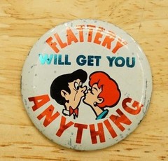Vintage Metal Pinback Button Japan Tin Litho Flattery Will Get You Anything
