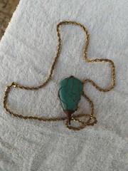 A braided red copper necklace a medium-sized, rare pear-shaped pure turquois