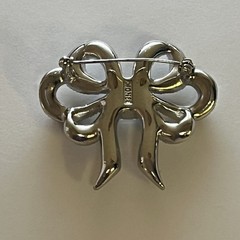 Vintage Monet Clear Rhinestones Bow Brooch Silver Tone Emerald Cut Center Stone