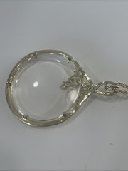 Vintage Magnifier Pendant Necklace. Gold tone. Made in USA in 1960’s. Hangs 15”