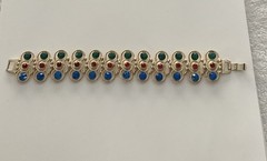 Vintage Gold Tone multi-gemstone link bracelet with a fold-over clasp 7’ in