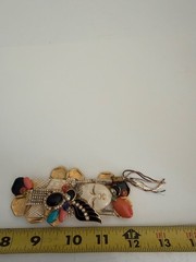 VINTAGE ASIAN BROOCH WITH CARVED FACE AND JEWLEL SIGNED