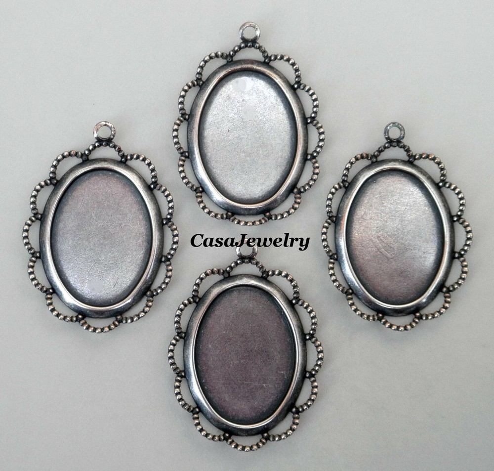 #1689 ANTIQUED STERLING SILVER PLATED 25×18 BEZEL W/RAISED LACE BORDER – 4 Pcs