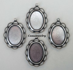 #1689 ANTIQUED STERLING SILVER PLATED 25×18 BEZEL W/RAISED LACE BORDER – 4 Pcs