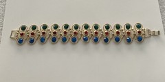 Vintage Gold Tone multi-gemstone link bracelet with a fold-over clasp 7’ in