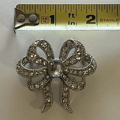 Vintage Monet Clear Rhinestones Bow Brooch Silver Tone Emerald Cut Center Stone