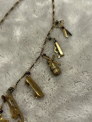 Pididdly Brass Necklace tiny Purple Glass Beads and 15 Mechanical Charms Vintage
